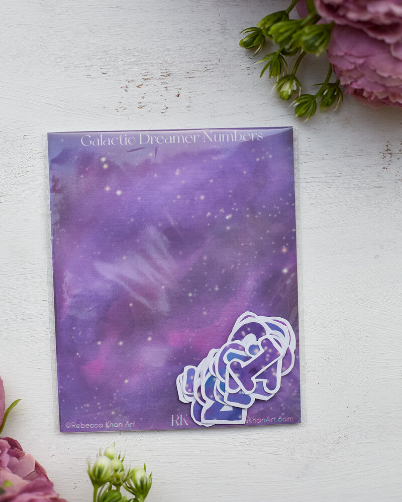 A sticker pack titled "Galactic Dreamer Numbers" with stickers that are starry galaxies in the shape of numbers.