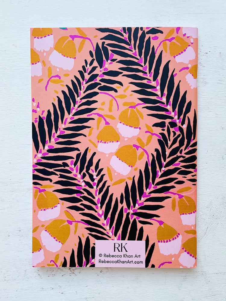 Back Cover of Peach Poetry A5 Notebook Featuring Black Leaves on Intertwining Branches with Semi-Abstract Flowers in Light Brown on a Peach Pink Background with Rebecca Khan Art Label.