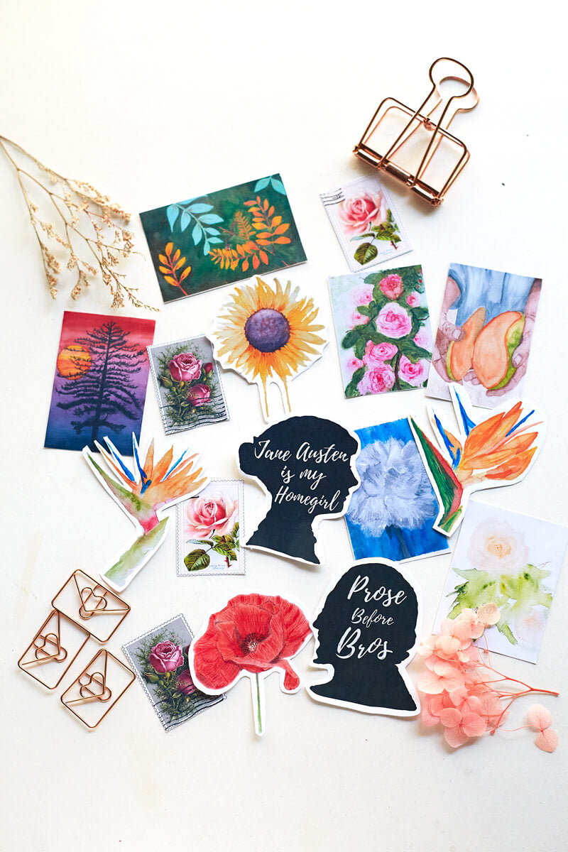 Assorted stickers with botanical and floral themes, some vintage stamp themes, a silhouette of Jane Austen with the words "Jane Austen is my homegirl" and a silhouette of William Shakespeare with the words "Prose Before Bros"
